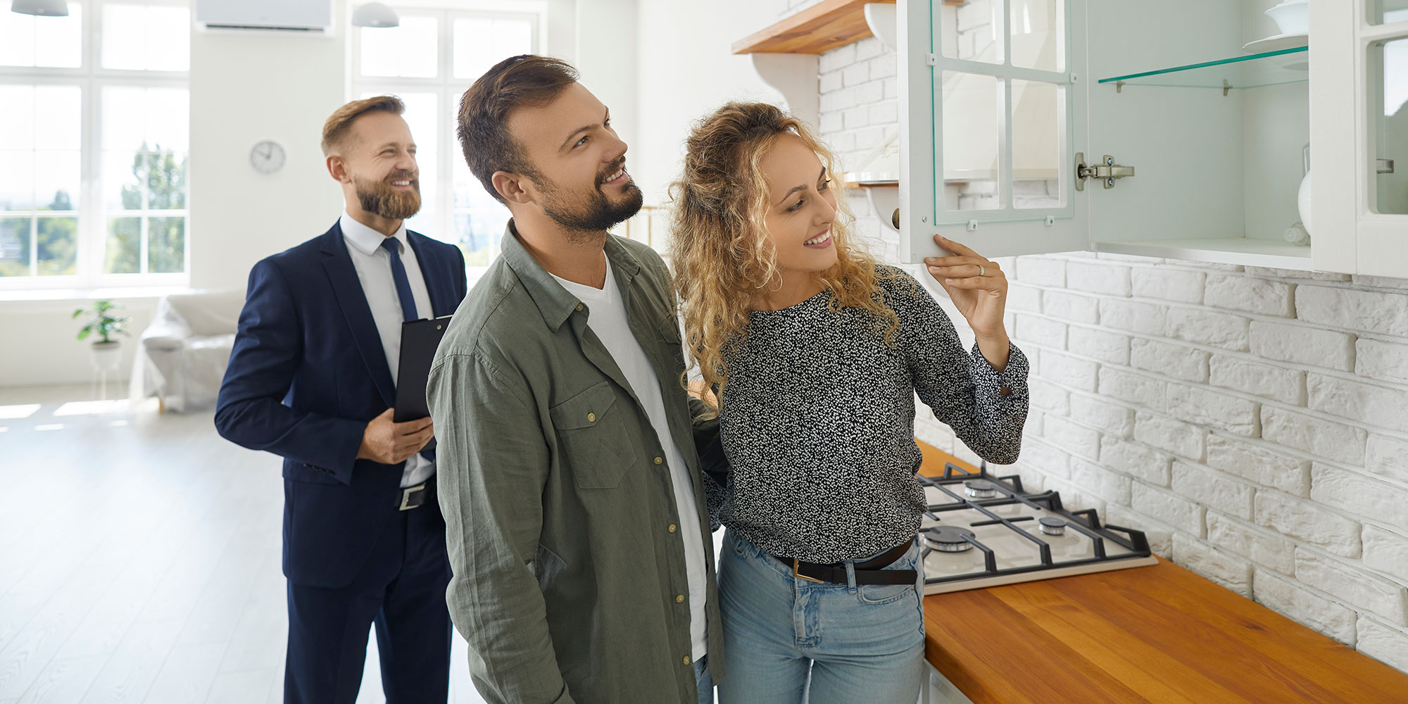 man and woman touring a home