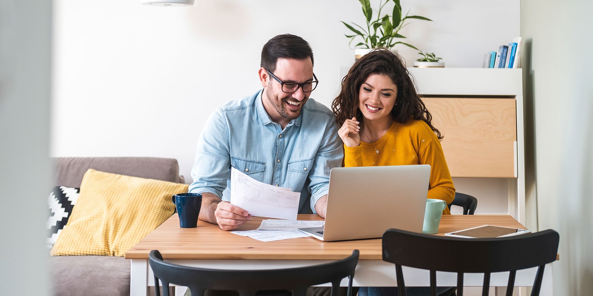 Couple looking over their financial goals for 2025.