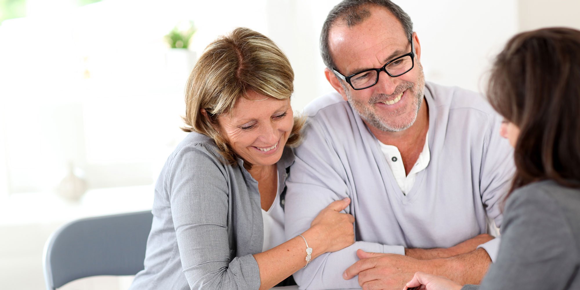 Older couple talking to a financial advisor.