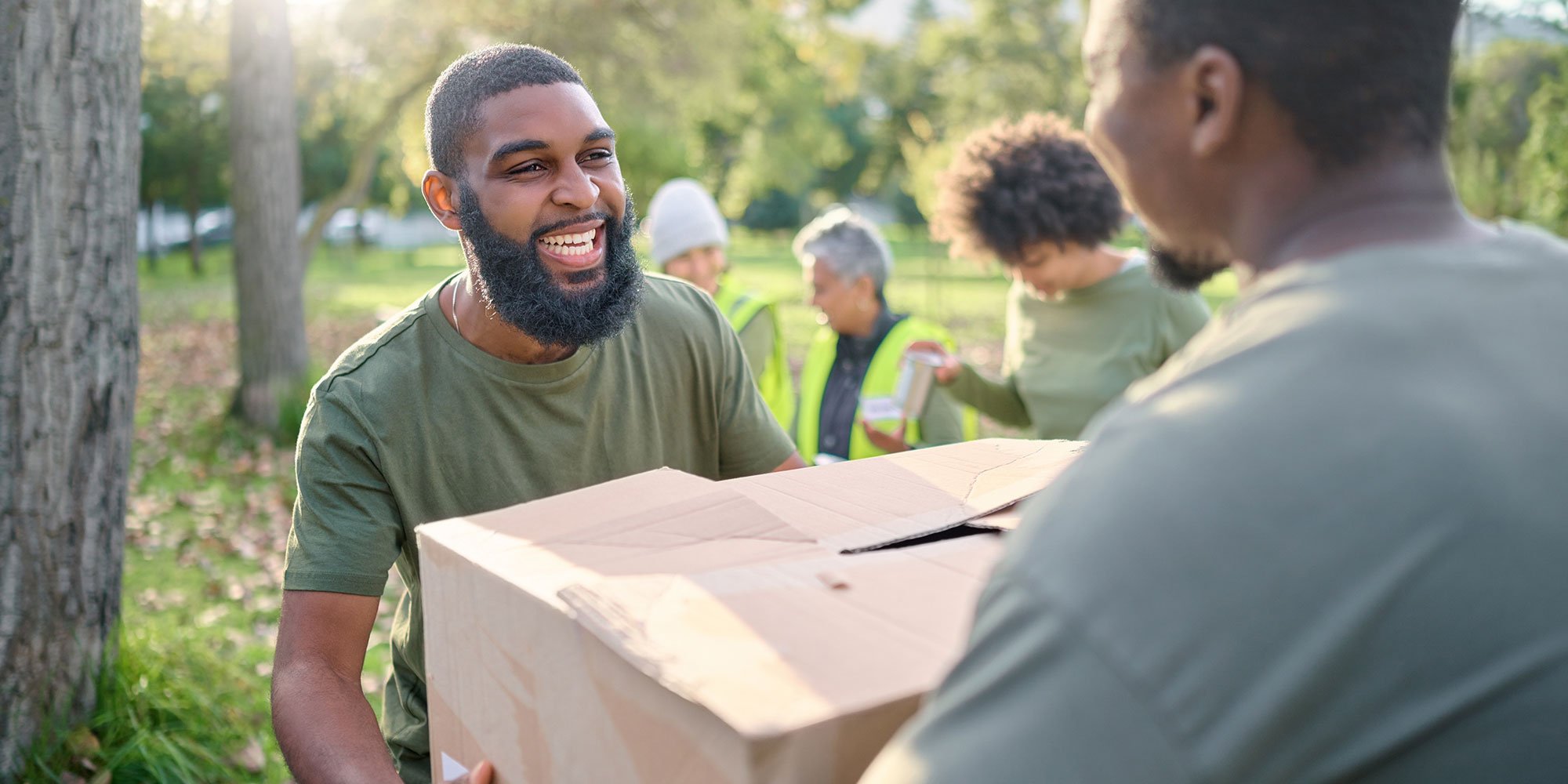 Man receiving a box and smiling. 